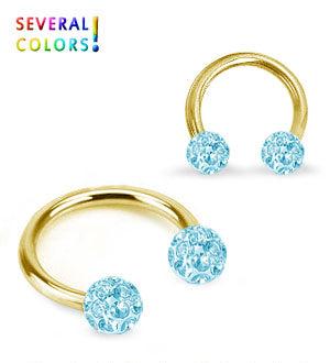 Kullanvärinen hevosenkenkä kristallipalloilla